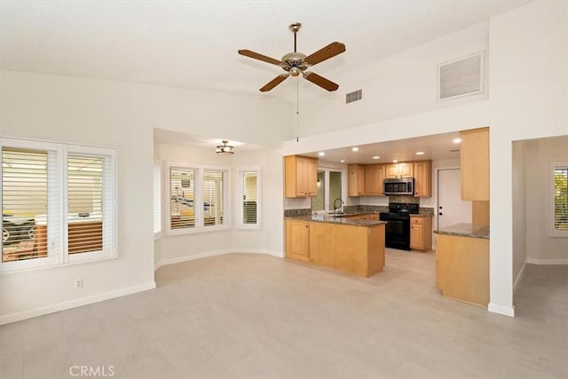 kitchen featuring high vaulted ceiling, light brown cabinetry, sink, kitchen peninsula, and black range with electric cooktop