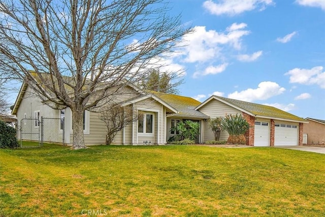 ranch-style house featuring a garage and a front lawn