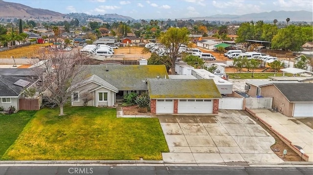 birds eye view of property with a mountain view