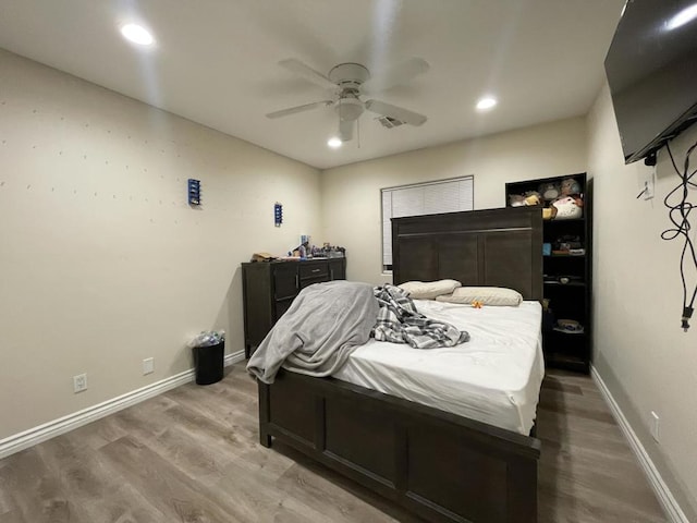 bedroom with hardwood / wood-style flooring and ceiling fan