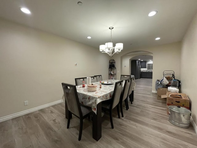 dining room featuring an inviting chandelier and hardwood / wood-style floors