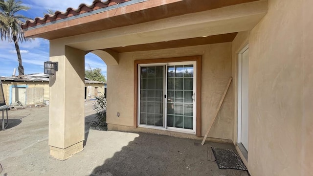 property entrance with a patio