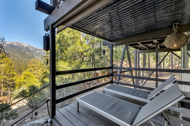 wooden terrace featuring a mountain view