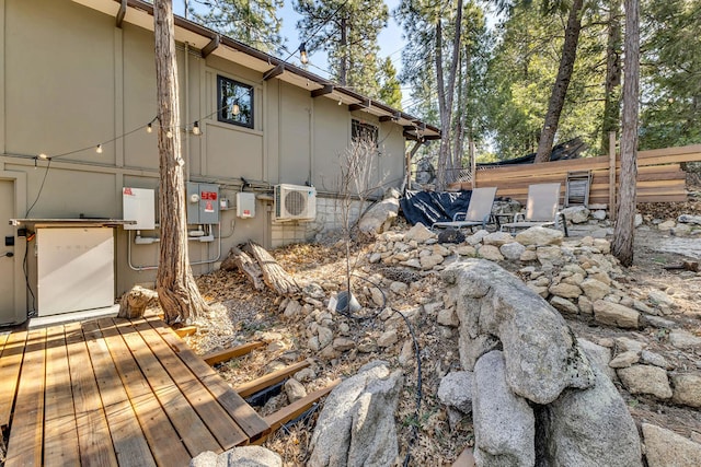 view of home's exterior featuring ac unit and a deck