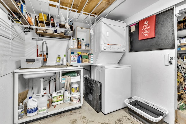 clothes washing area with stacked washer / drying machine