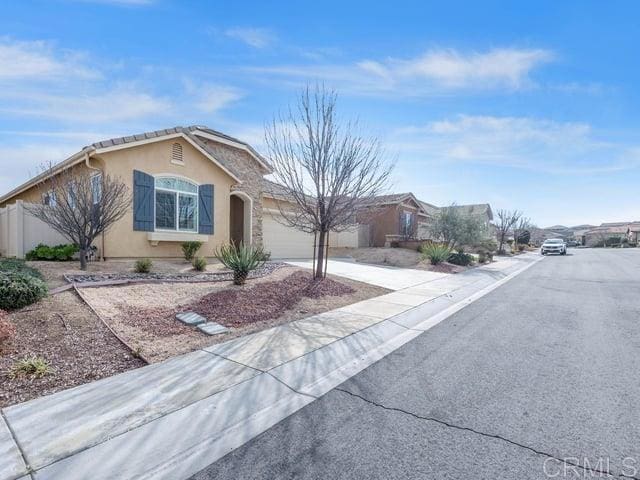 single story home featuring a garage