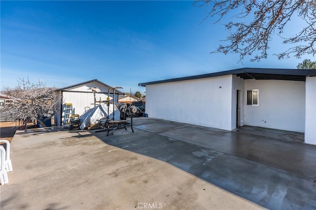 exterior space featuring a carport