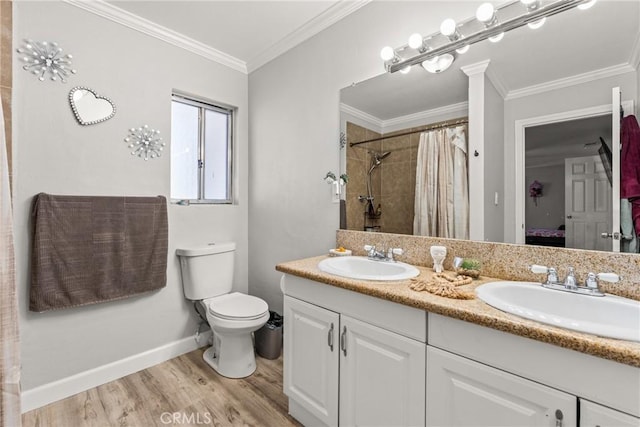 bathroom featuring hardwood / wood-style floors, ornamental molding, vanity, toilet, and a shower with shower curtain