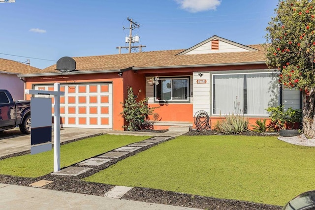 ranch-style house with a garage and a front lawn