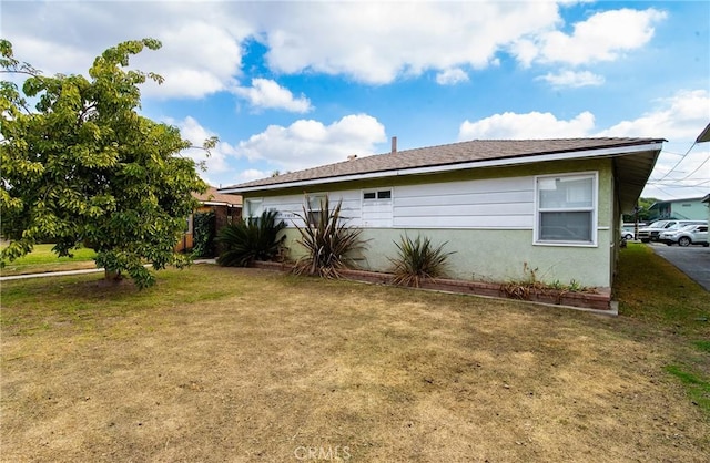 view of property exterior featuring a yard