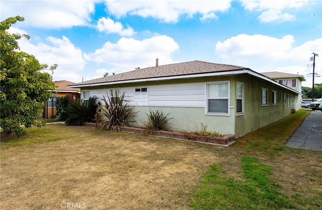 view of home's exterior with a yard