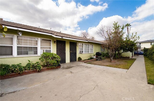 single story home featuring a patio