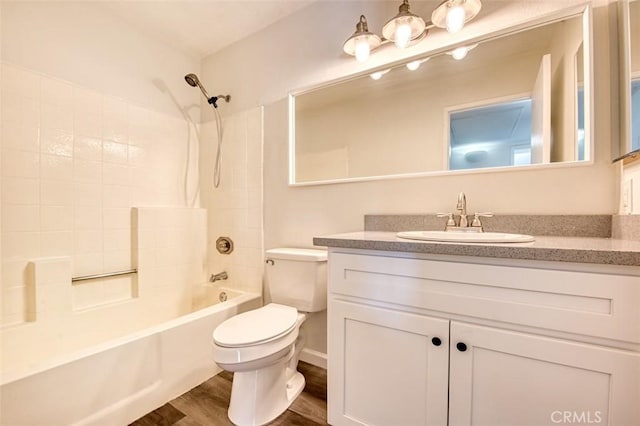 full bathroom featuring vanity, wood-type flooring, toilet, and shower / bath combination