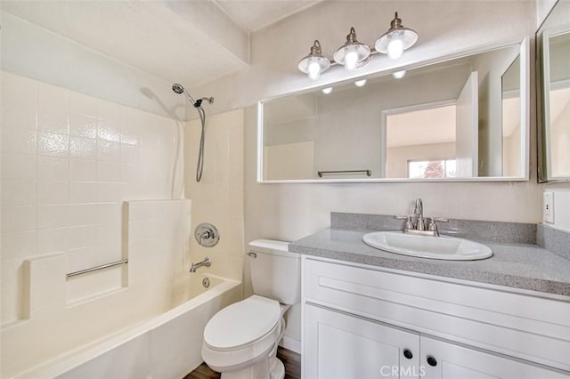 full bathroom with vanity, shower / tub combination, and toilet