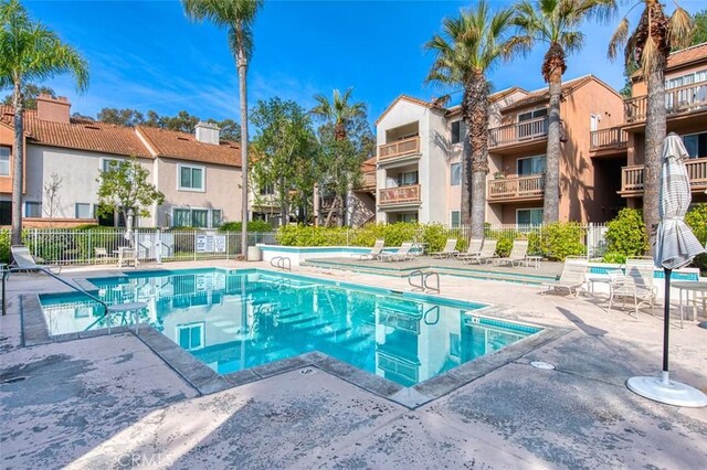 view of swimming pool with a patio area