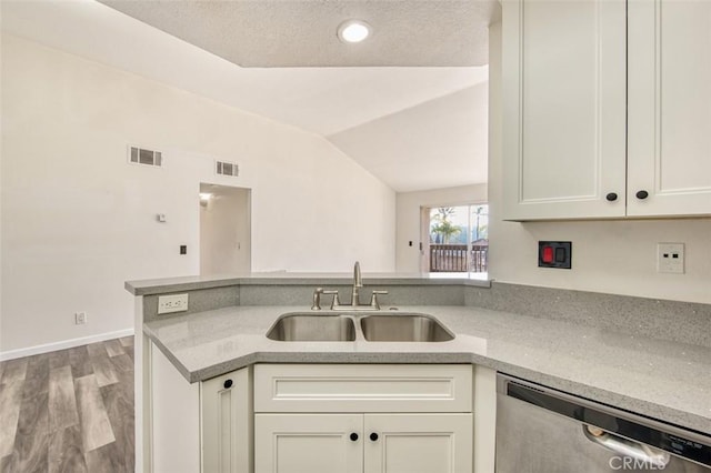 25246 San Michele, Laguna Niguel, CA 92677 - kitchen with vaulted ceiling, a sink, visible vents, and stainless steel dishwasher