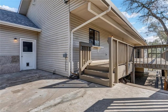 doorway to property with a patio area