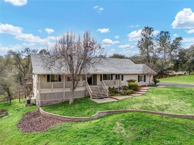 view of front of home featuring covered porch and a front yard