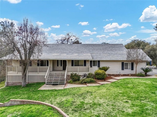 view of front of property with a porch and a front yard