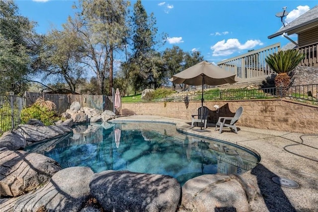 view of pool featuring a patio