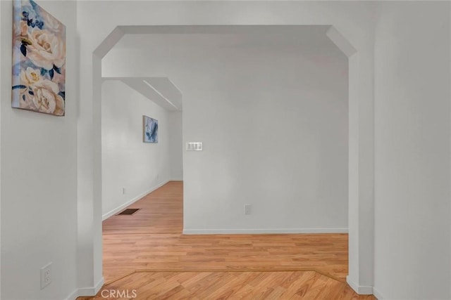 empty room featuring wood-type flooring