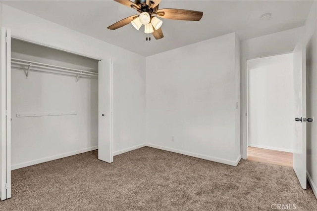 unfurnished bedroom featuring ceiling fan, carpet floors, and a closet