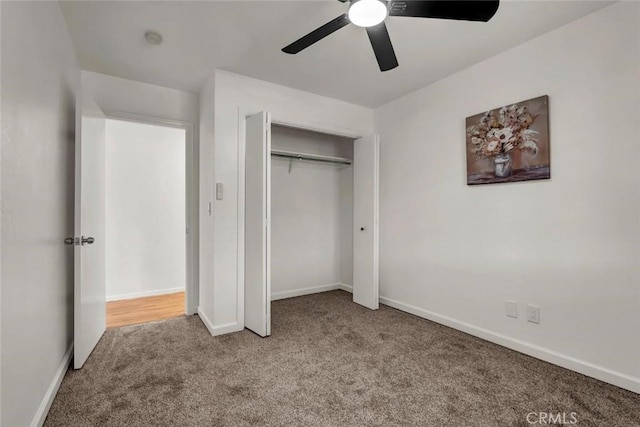 unfurnished bedroom with carpet floors, ceiling fan, and a closet