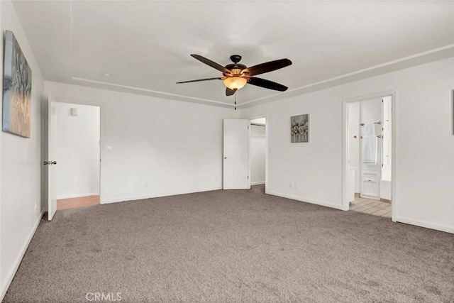 unfurnished room featuring light carpet and ceiling fan