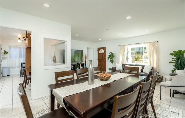 dining room with light tile patterned flooring and recessed lighting