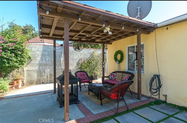 view of patio / terrace featuring fence and an outdoor living space