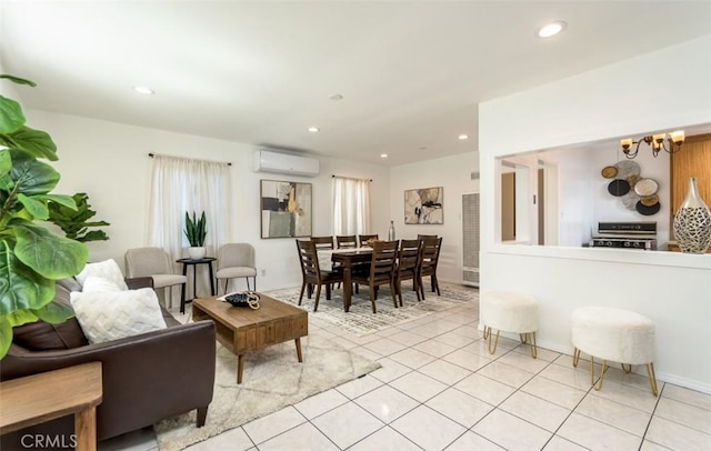 living room featuring recessed lighting, a wall unit AC, a notable chandelier, and light tile patterned flooring