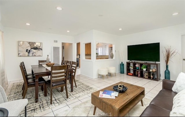 living room with light tile patterned floors and recessed lighting