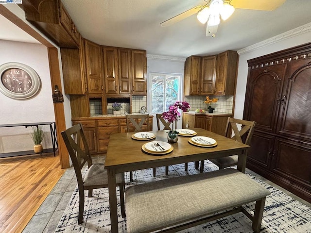 dining area featuring ceiling fan and light hardwood / wood-style floors