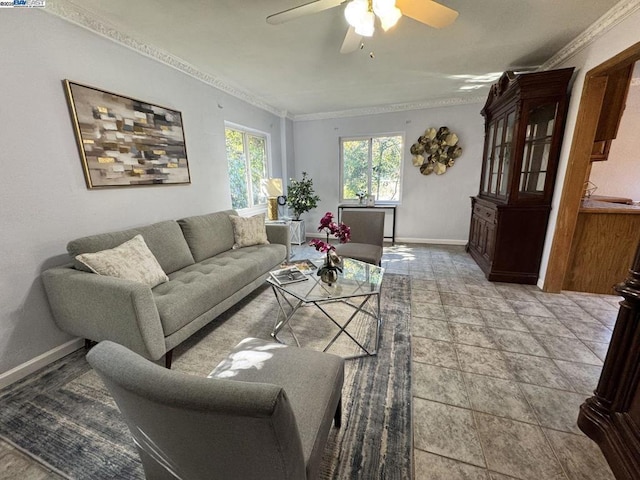 living room with ornamental molding and ceiling fan