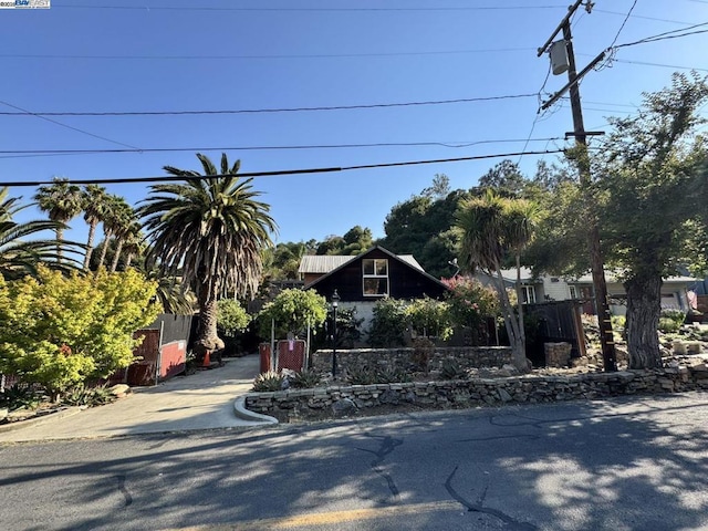 view of property hidden behind natural elements