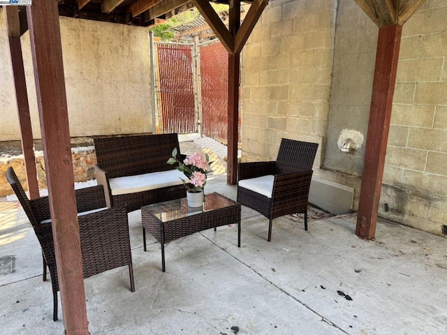 view of patio / terrace featuring a pergola and an outdoor hangout area