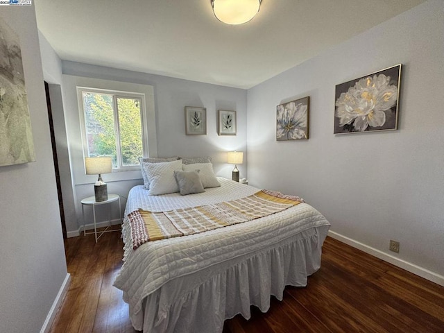 bedroom featuring dark hardwood / wood-style floors