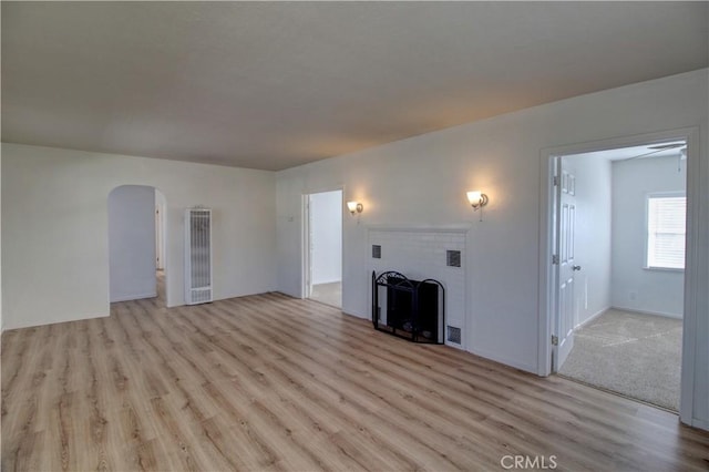 unfurnished living room with light wood-type flooring