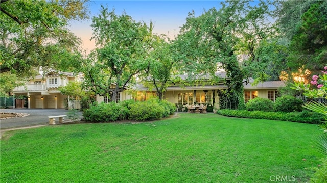 view of front of home with a yard