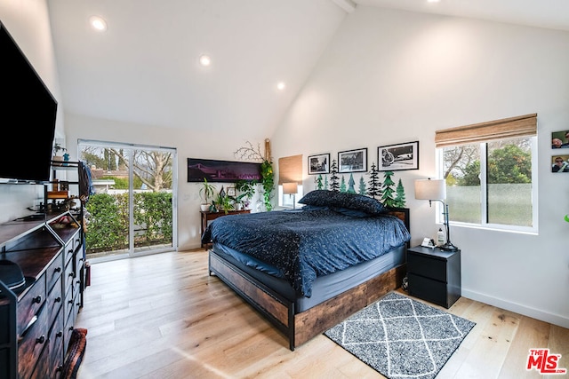 bedroom featuring beam ceiling, high vaulted ceiling, access to outside, and light wood-type flooring