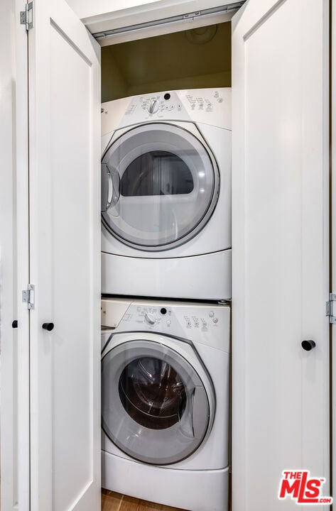 washroom with stacked washer and clothes dryer