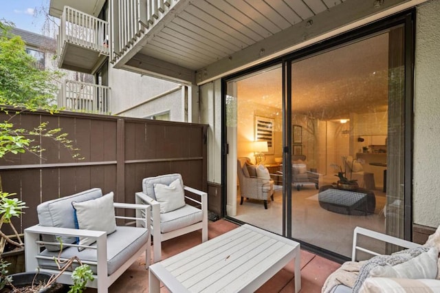 exterior space with an outdoor living space and a balcony