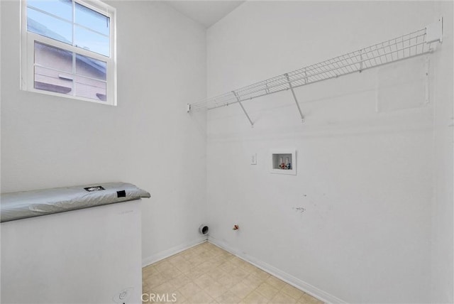 laundry area with hookup for a gas dryer and washer hookup