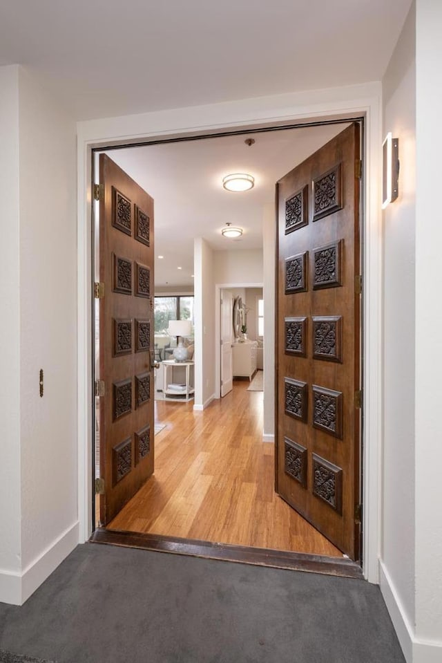 hallway with light wood-type flooring