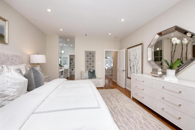 bedroom with dark hardwood / wood-style flooring