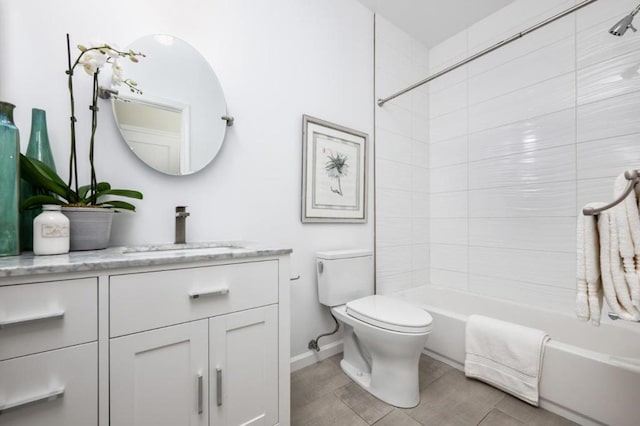 full bathroom featuring vanity, toilet, and tiled shower / bath combo