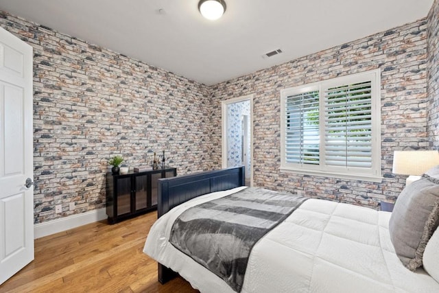 bedroom with light hardwood / wood-style flooring