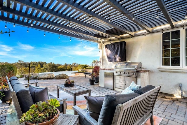 view of patio / terrace with an outdoor kitchen, area for grilling, an outdoor hangout area, and a pergola