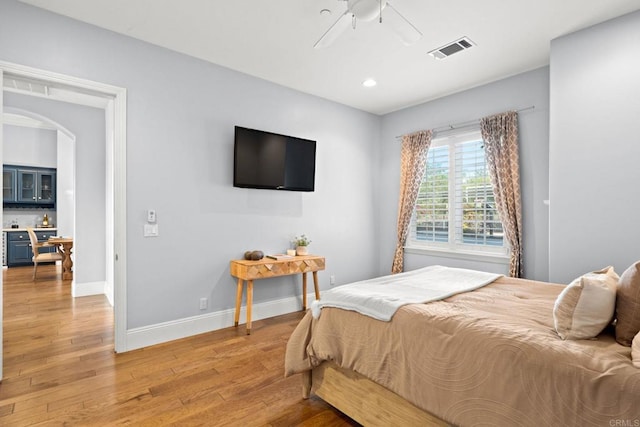 bedroom featuring hardwood / wood-style flooring and ceiling fan