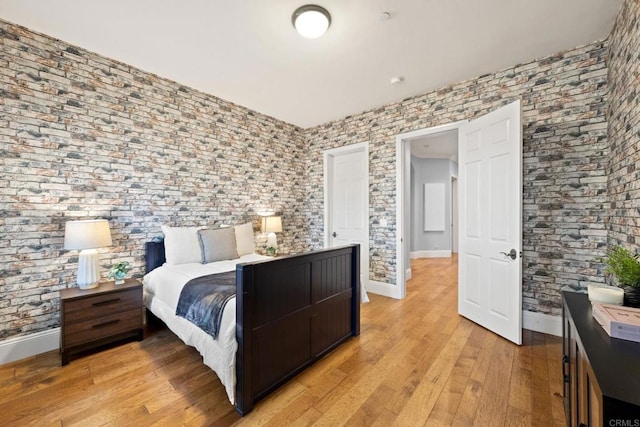 bedroom with light hardwood / wood-style flooring